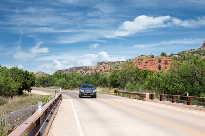 car driving down Texas road